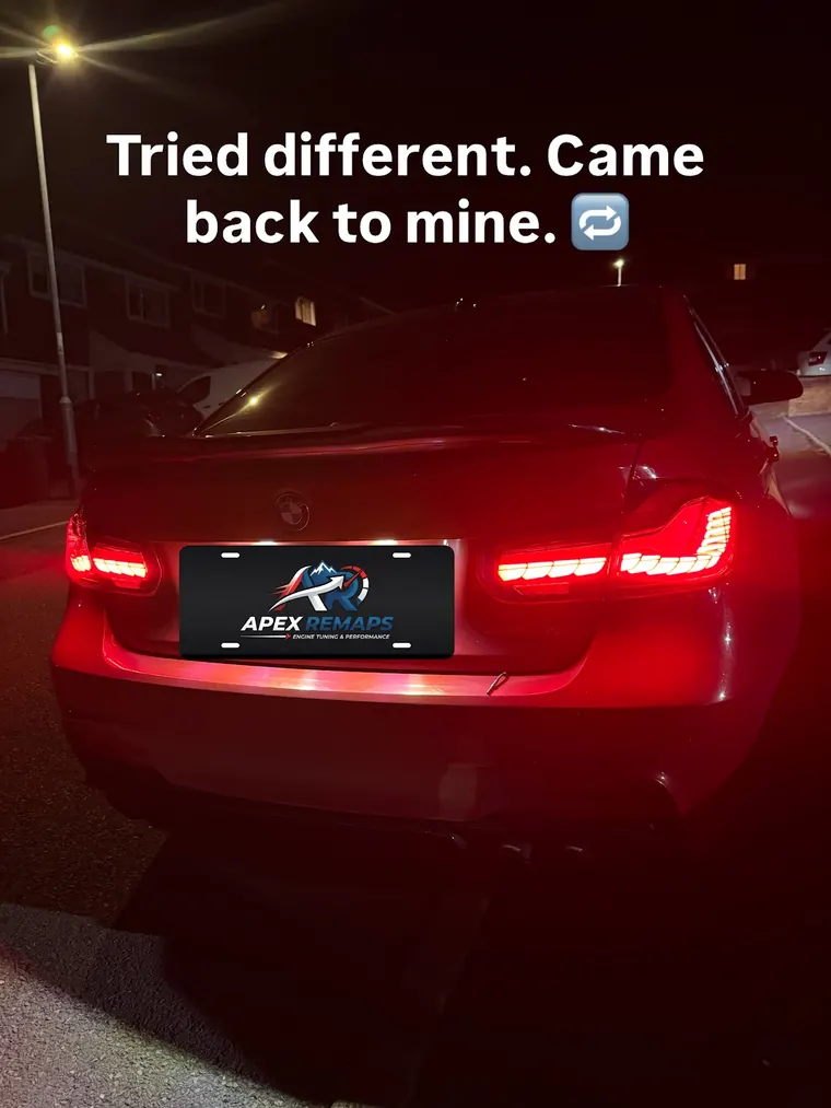 Red BMW at night with Apex Remaps branding covering the number plate