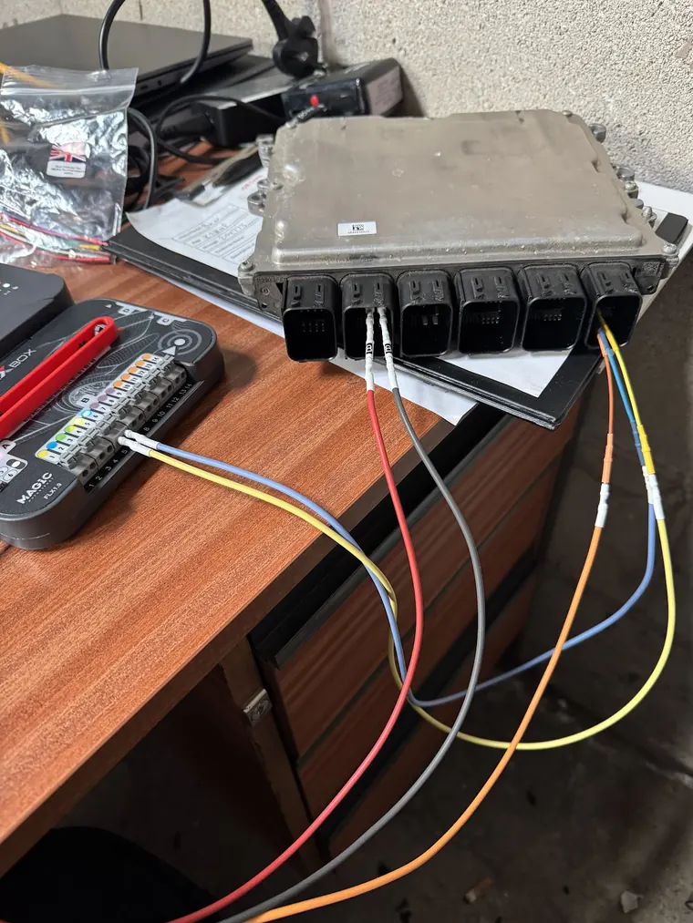 Engine control unit connected to bench wiring and programming interface